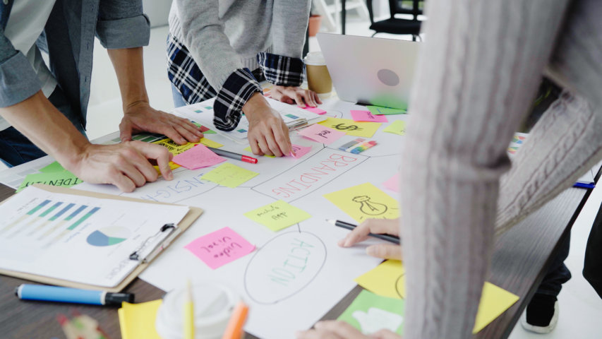 optimize-group-casually-dressed-business-people-discussing-ideas-office.jpg