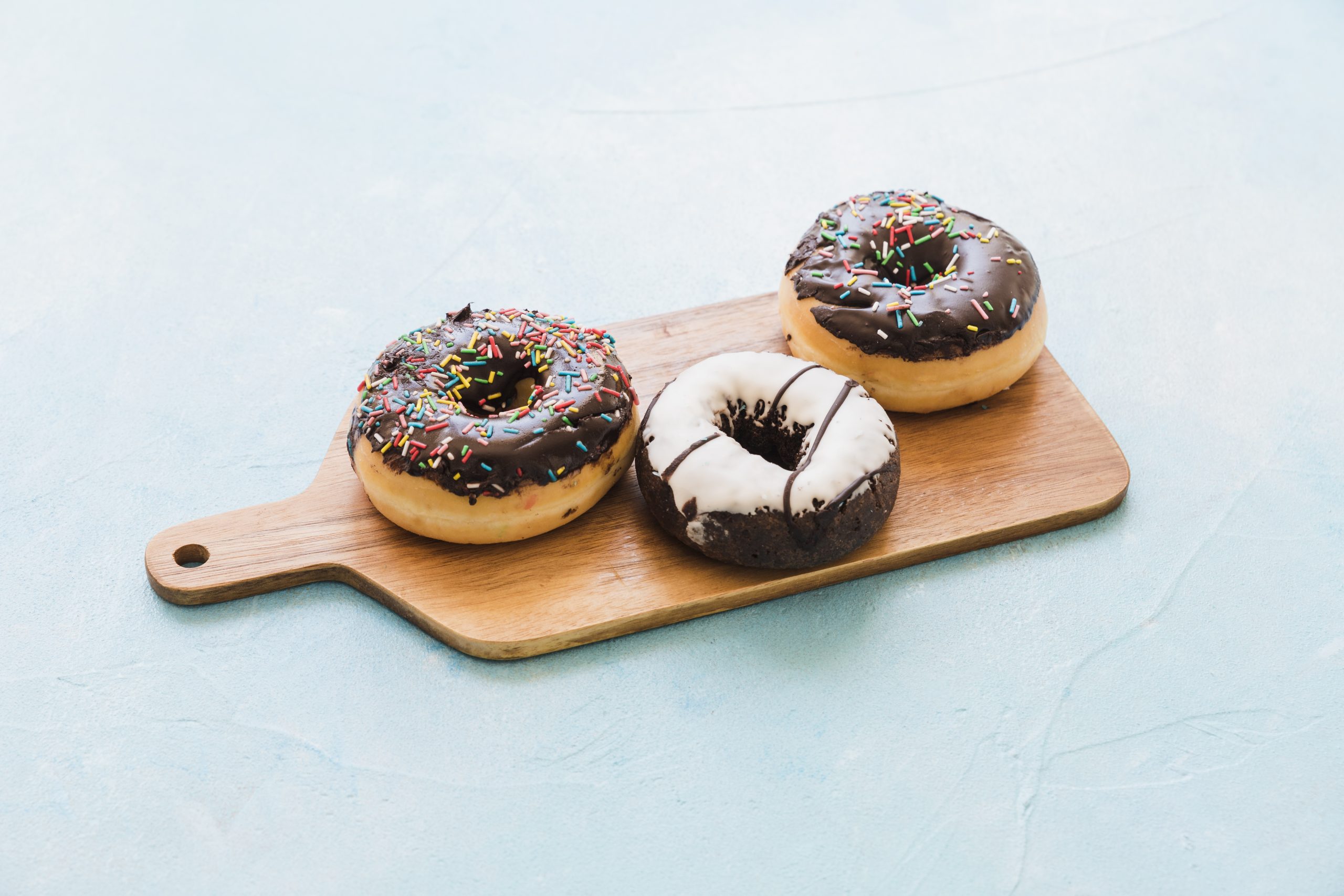 fresh-chocolate-donuts-chopping-board-scaled.jpg