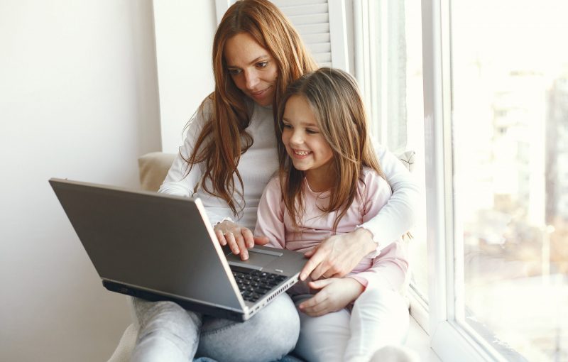 woman-with-daughter-using-laptop-computer-scaled-1.jpg